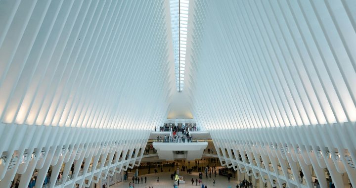 Modern architectural view of the Oculus in NYC, showcasing its futuristic design and bustling interior.